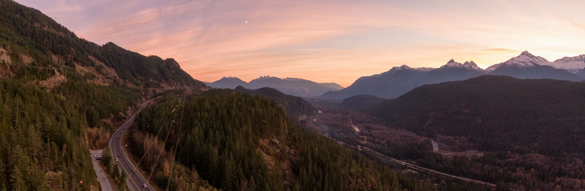 Highway winding through mountains at dusk