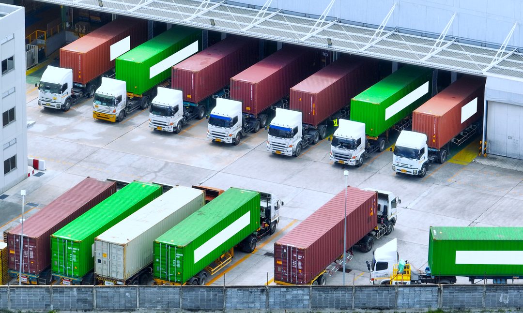 Container trucks at warehouse loading docks