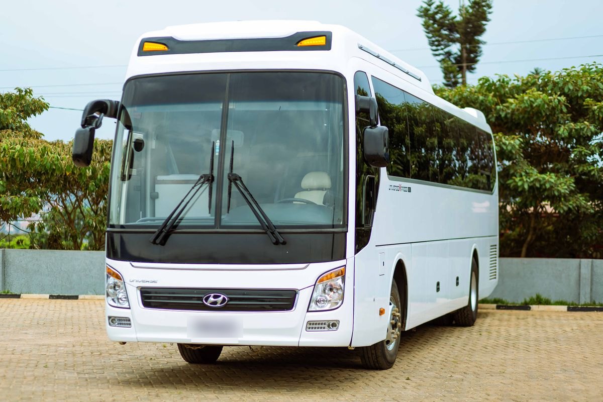 Sample motorcoach website: a white full-size coach parked on a paved lot