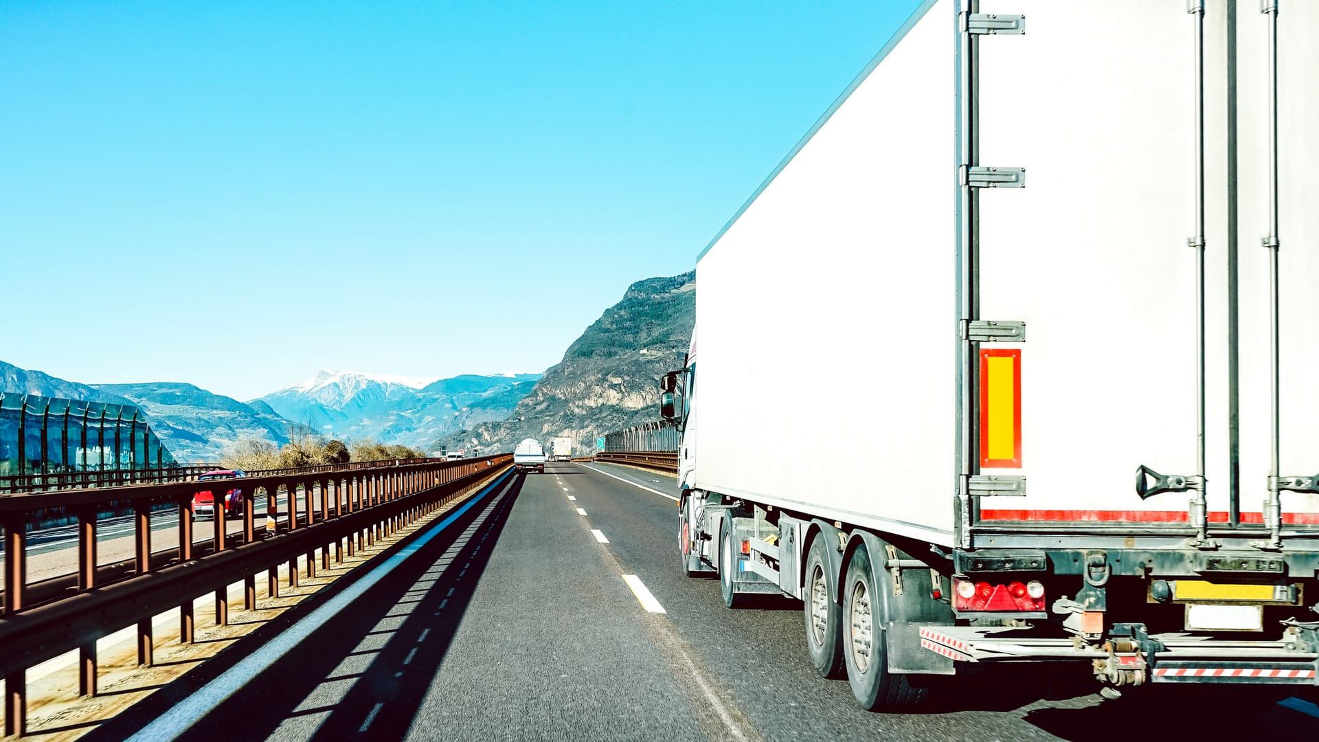 Sample carrier website: a white semi trailer on a mountain highway